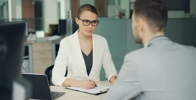 An HR meeting between two employees in an office
